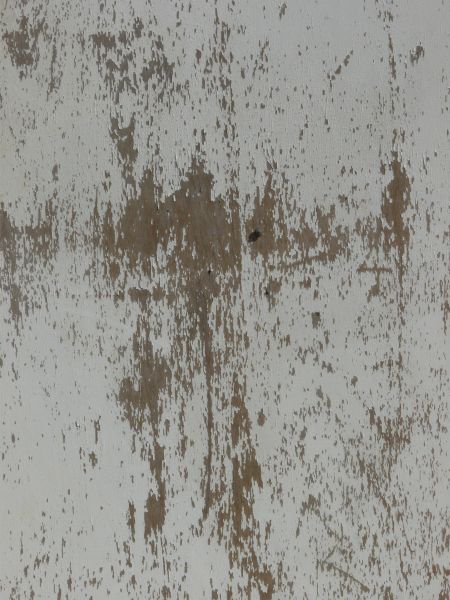 White painted wood texture, covered with various chips and scratches, and brown wood visible underneath.